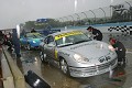 The team makes a quick tire change during the Watkins Glen sog-fest. 