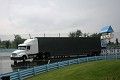 The team's rig pulls in on a soggy unloading day. 