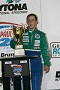 An exhausted Wayne Nonnamaker collects the first place trophy after driving the entire Paul Revere 250 by himself. 